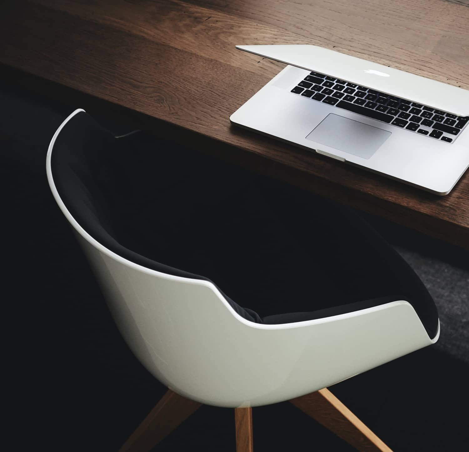 Apple MacBook beside computer mouse on table by Luca Bravo via Unsplash